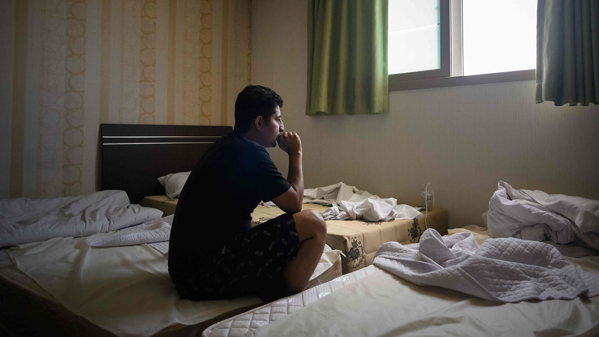 In a photo taken on 4 July 2018, Yemeni asylum seeker Farooq, 32, sits in a room at the Olle Tourist Hotel in Jeju. Photo: AFP
