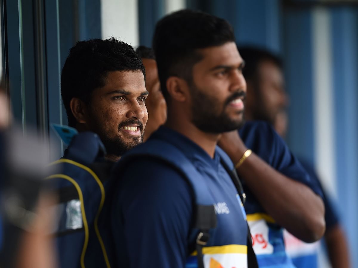 Sri Lankan cricket team captain Dinesh Chandimal (L) looks on at a practice session at the R. Premadasa Stadium in Colombo on 6 July 2018. Photo: AFP