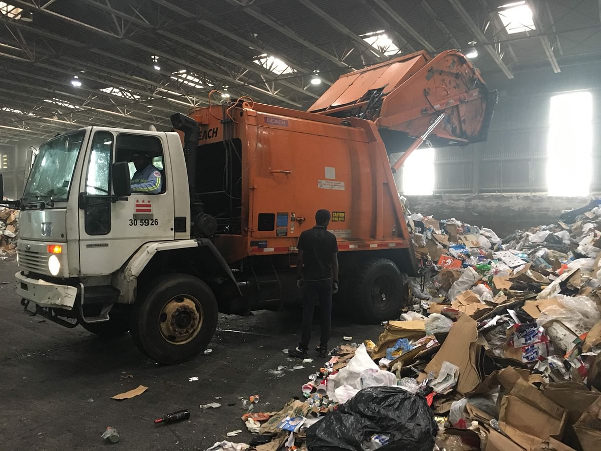 Trucks deliver trash and recycling waste at the District of Columbia’s Fort Totten Transfer Station in Washington, DC, on 10 July 2018 Since China, the top global importer of recyclable materials for years, has stopped to accept recyclables from countries including the United States in January on grounds of `contamination`, the US is struggling with an excess amount of recyclable material and no streamlined process to deal with it. Photo: AFP