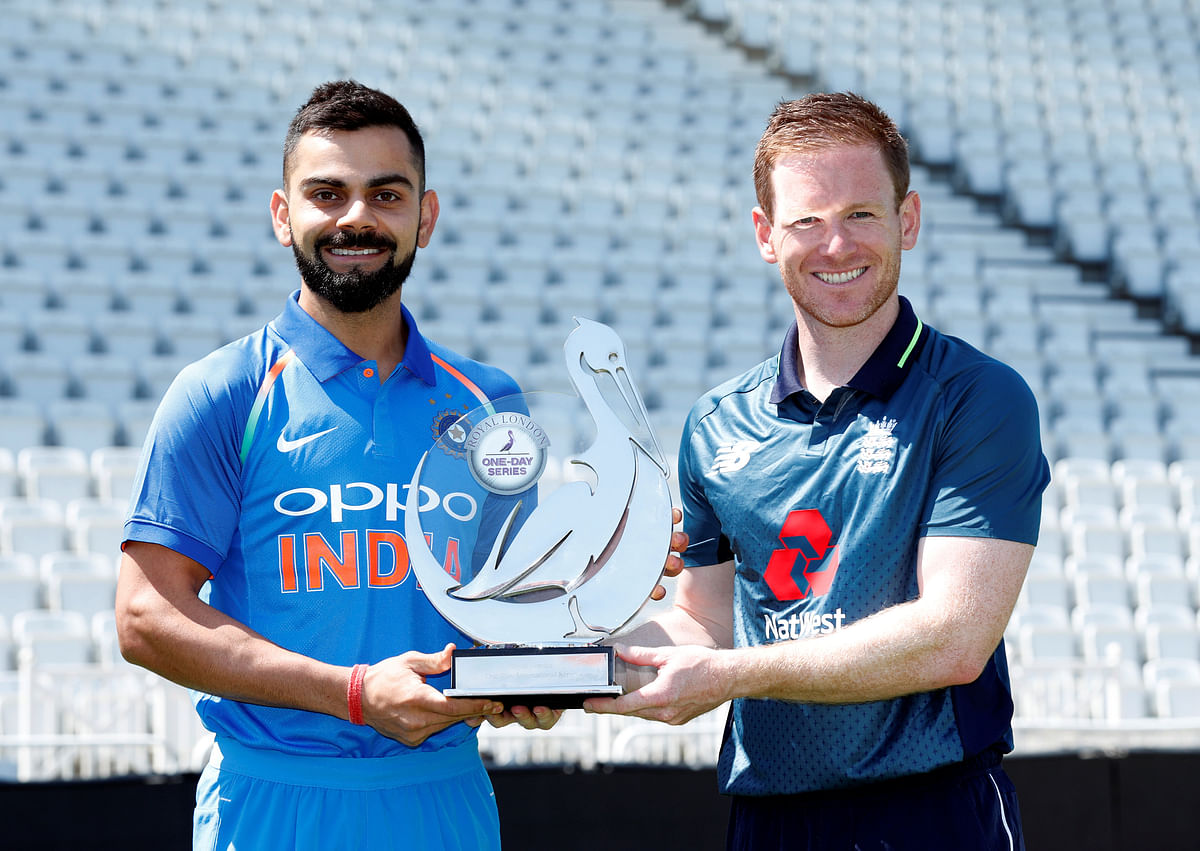 India`s Virat Kohli and England`s Eoin Morgan pose with the trophy at Trent Bridge, Nottingham, Britain on 11 July 2018. Photo: Reuters