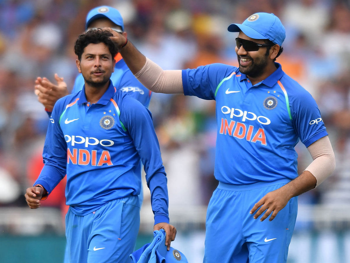 India`s Kuldeep Yadav (L) celebrates after finishing his spell, taking his sixth wicket, that of England`s David Willey during the One Day International (ODI) cricket match between England and India at Trent Bridge in Nottingham central England on 12 July, 2018. Photo: AFP