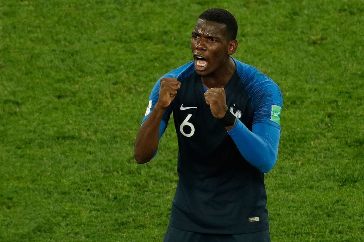 France`s midfielder Paul Pogba celebrates at the end of the Russia 2018 World Cup semi-final football match between France and Belgium at the Saint Petersburg Stadium in Saint Petersburg on 10 July 2018. Photo: AFP