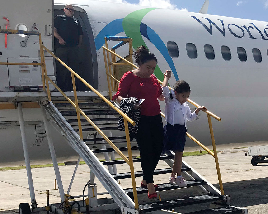 Donelda Pulex and her 5-year-old daughter Marelyn, step off a chartered flight from the US in Guatemala City, Guatemala, after the two were deported after being separated crossing the US border. Pulex said she was tormented by the idea she’d never see her child again. Photo : AP