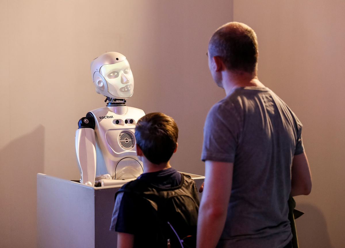 Visitors are seen at a robots exhibition at a pavilion of the Exhibition of Achievements of National Economy (VDNKh) in Moscow, Russia on 10 July 2018. Photo: Reuters