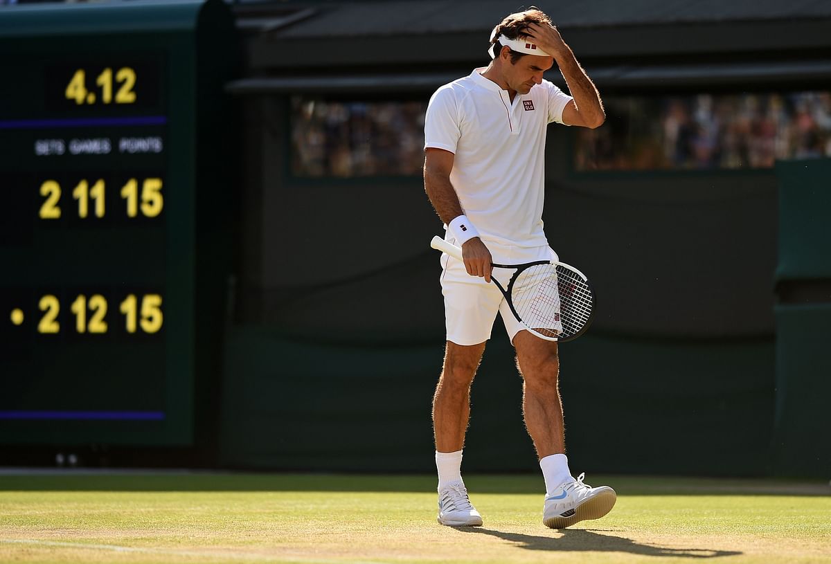 Switzerland`s Roger Federer reacts as he plays South Africa`s Kevin Anderson in their men`s singles quarter-finals match on the ninth day of the 2018 Wimbledon Championships at The All England Lawn Tennis Club in Wimbledon, southwest London, on 11 July 2018. AFP