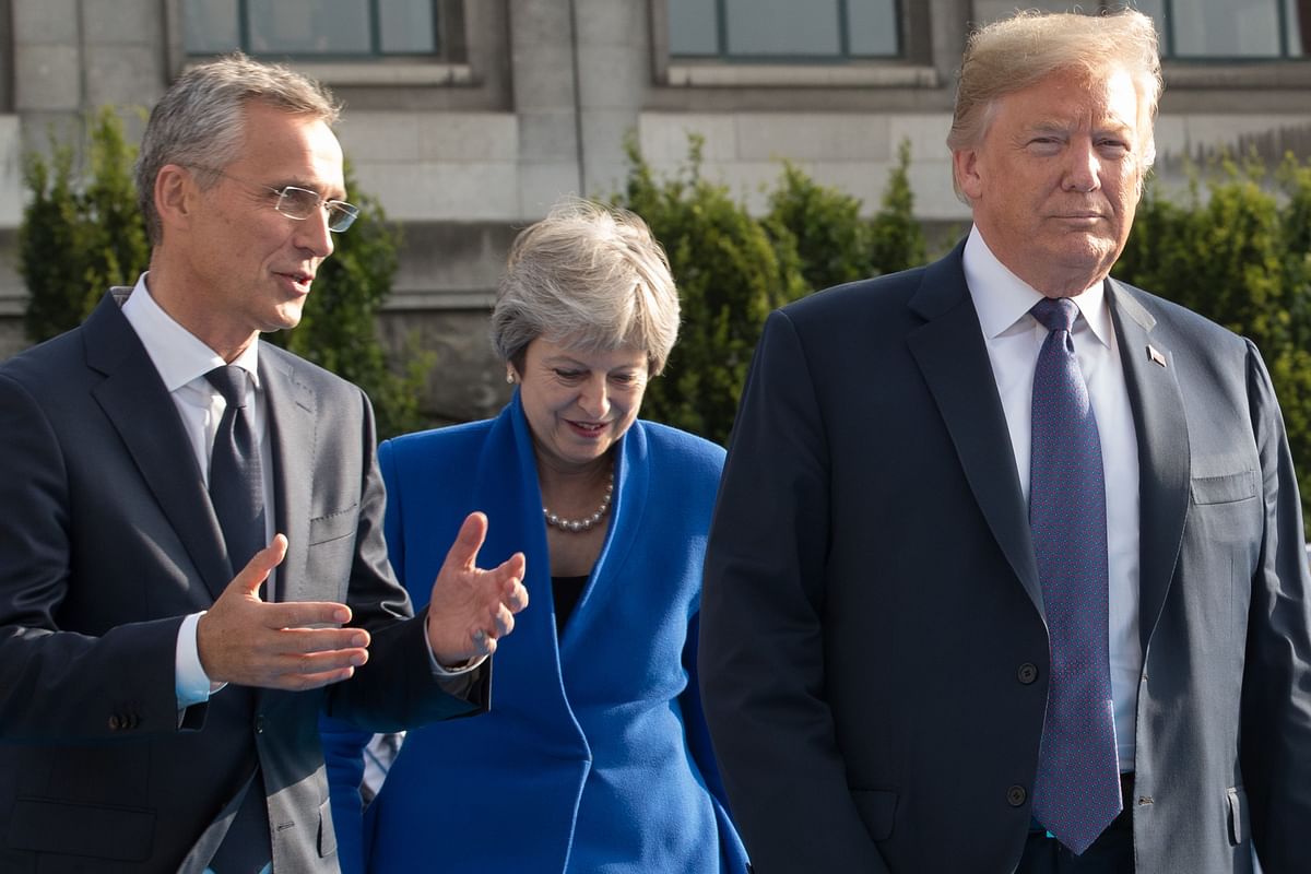 NATO secretary general Jens Stoltenberg, prime minister of the United Kingdom Theresa May and US president Donald Trump arrive for a working dinner at The Parc du Cinquantenaire - Jubelpark Park in Brussels on 11 July 2018, during the North Atlantic Treaty Organisation (NATO) summit. Photo: AFP