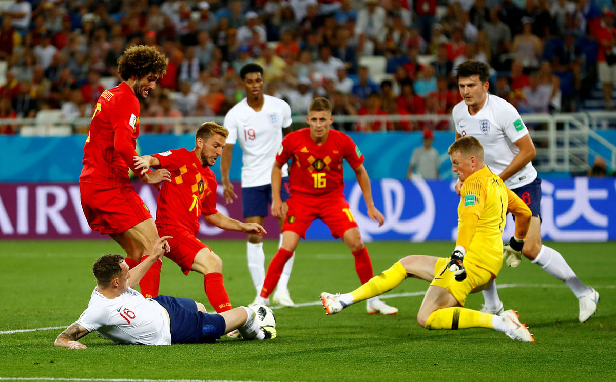 Belgium`s Marouane Fellaini and Dries Mertens in action with England`s Phil Jones and Jordan Pickford in group stage match. Photo: Reuters