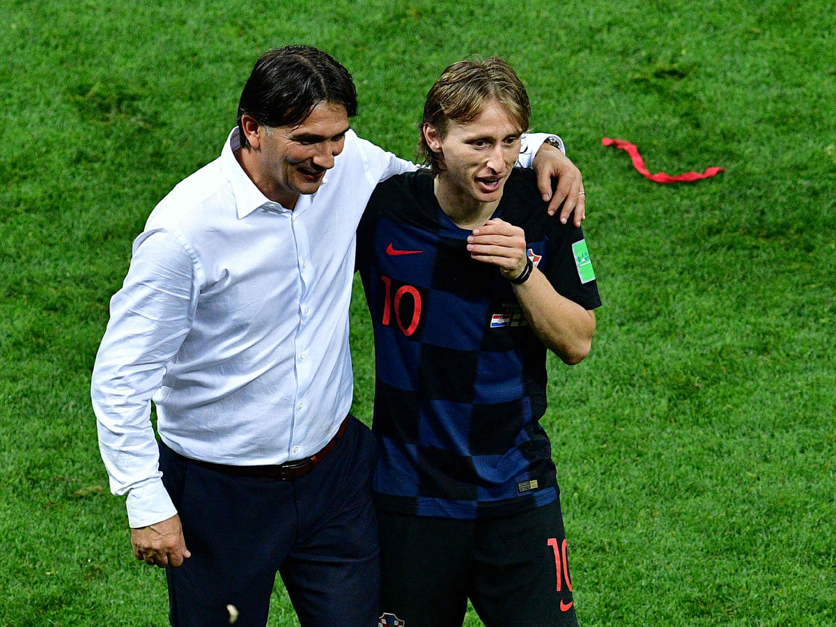 Croatia captain Luka Modric (R) and coach Zlatko Dalic celebrate after winning the semifinal against England at the Luzhniki Stadium in Moscow on July 11, 2018. AFP
