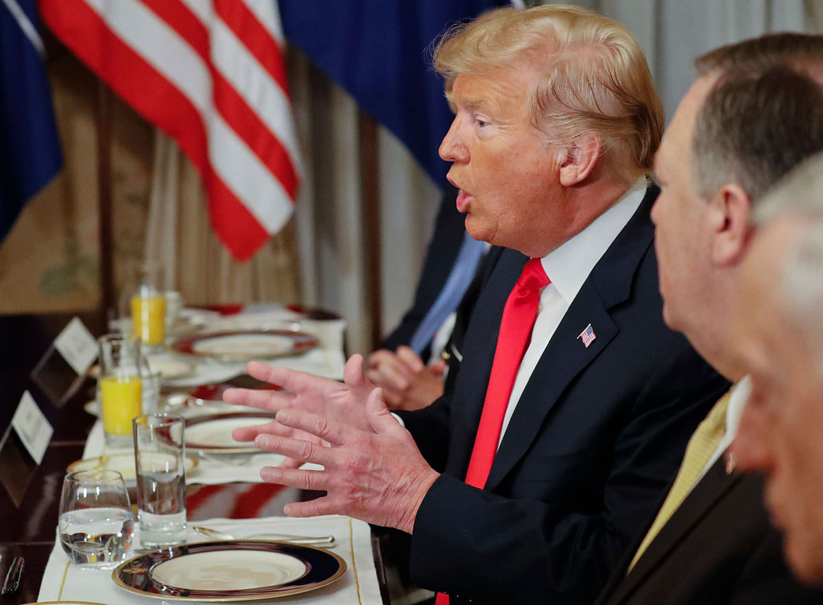 US president Donald Trump gestures while speaking to NATO secretary general Jens Stoltenberg during their bilateral breakfast, Wednesday, 11 July 2018 in Brussels, Belgium. Photo : AP