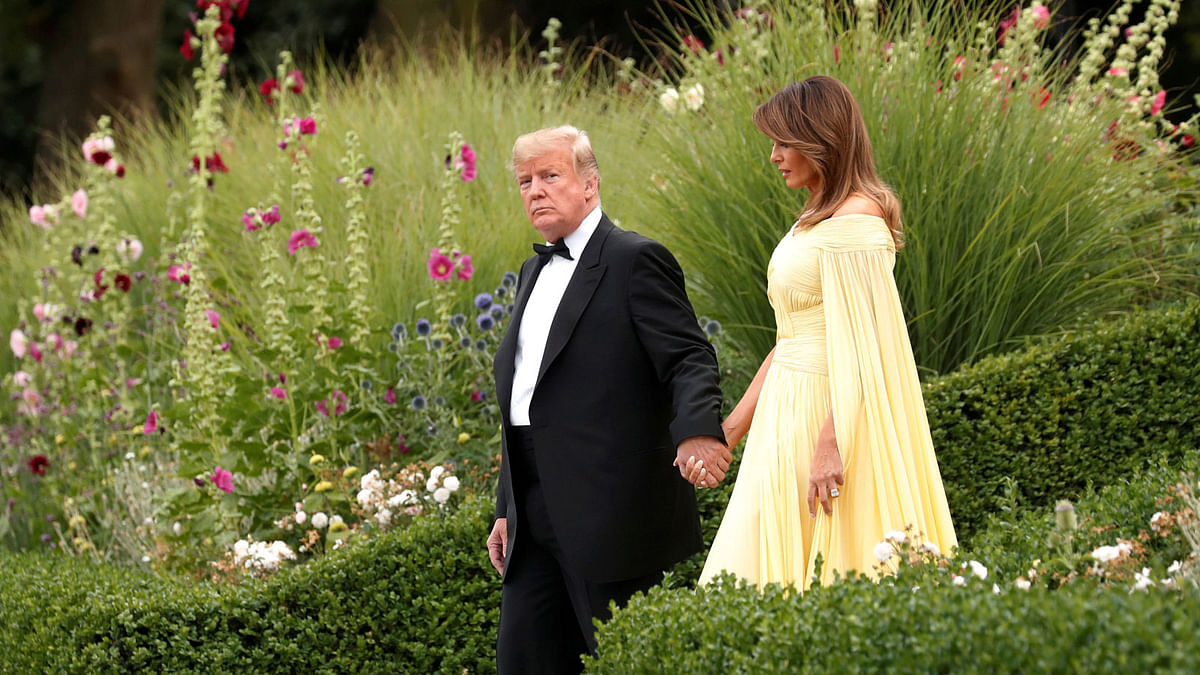 US president Donald Trump and the first Lady Melania Trump leave the US ambassador`s residence, Winfield House, on their way to Blenheim Palace for dinner with Britain`s prime minister Theresa May and business leaders, in London, Britain, 12 July 2018. Photo: Reuters