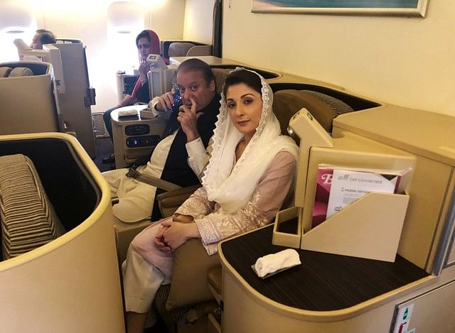 Ousted Pakistani prime minister Nawaz Sharif and his daughter Maryam sit on a Lahore-bound flight due for departure, at Abu Dhabi International Airport, UAE 13 July 2018. Photo: Reuters