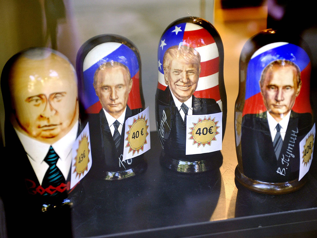 Russian Matryoshka dolls depicting Russian president Vladimir Putin and US president Donald Trump are on sale in the Ruslania book store in Helsinki on 9 July 2018. Photo: AFP