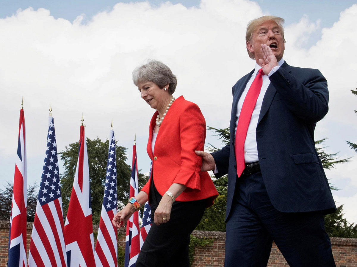 US president Donald Trump walks with Britain`s prime minister Theresa May prior to a joint press conference at Chequers, near Aylesbury, Britain on 13 July 2018.Photo: Reuters