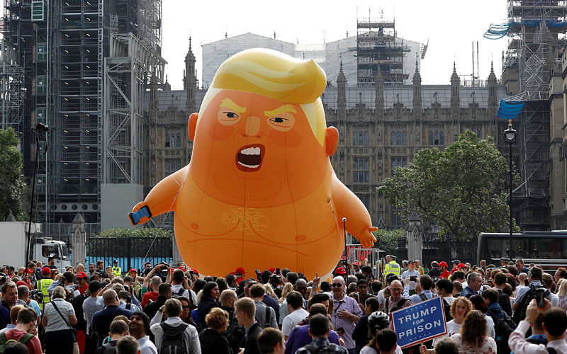 Demonstrators fly a blimp portraying US president Donald Trump, in Parliament Square, during the visit by Trump and first lady Melania Trump in London, Britain on 13 July. Photo: Reuters