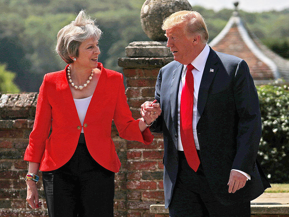 Britain’s prime minister Theresa May and US president Donald Trump walk to a joint news conference at Chequers, the official country residence of the prime minister, near Aylesbury, Britain on 13 July. Photo: Reuters