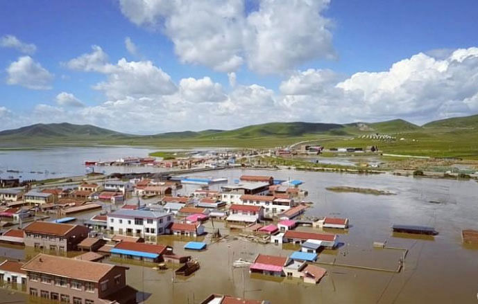 A flooded village is seen Zoige County, Sichuan, China on 13 July 2018 in this still image taken from a video obtained from social media on 14 July 2018. -- Reuters