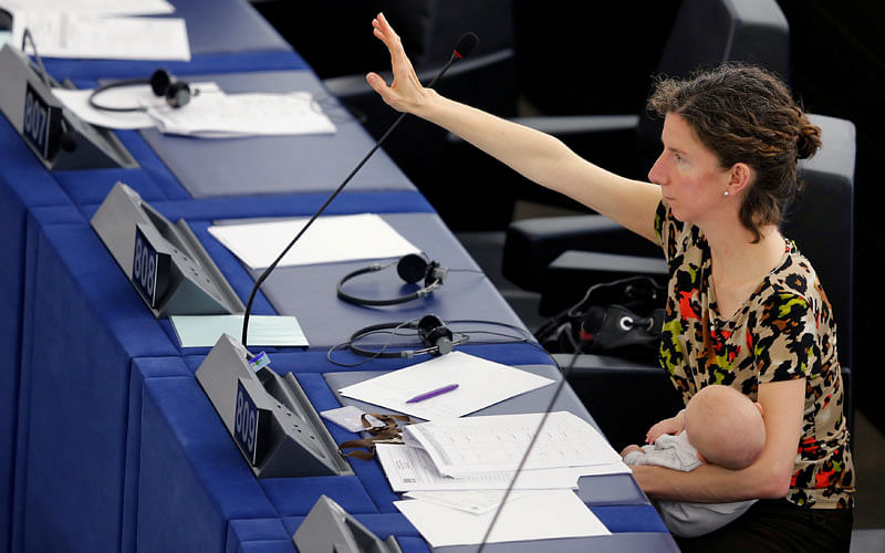 European Parliament Member Anneliese Dodds of the UK, holds her baby as she arrives to take part in a voting session at the European Parliament in Strasbourg, France on14 April 2016. Photo: Reuters