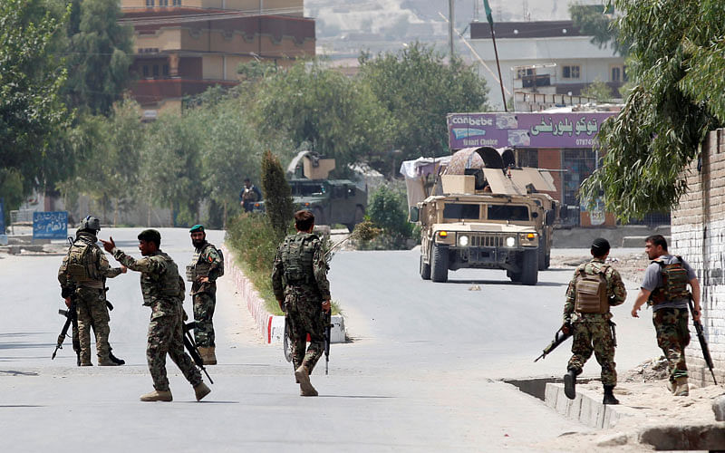 Afghan National Army (ANA) soldiers arrive at the site of gunfire and attack in Jalalabad city, Afghanistan on 11 July 2018. Photo: Reuters