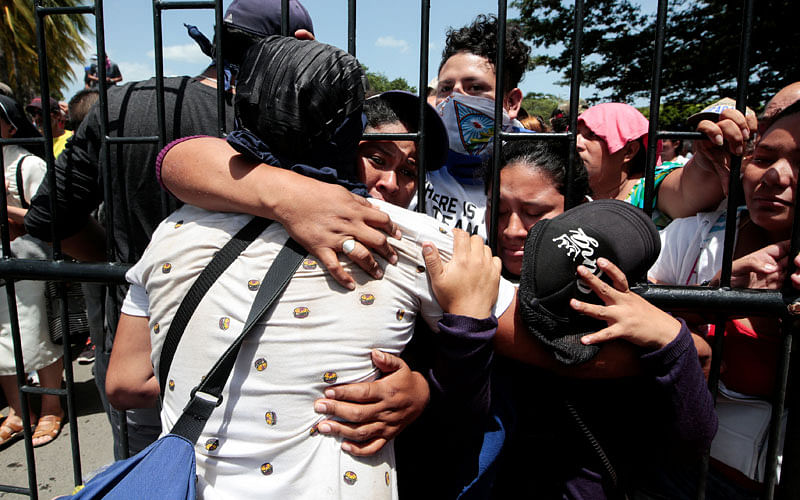 Relatives embrace an university student who was freed after being trapped overnight in Divine Mercy Catholic Church where they took shelter as pro-government gunmen shot at them at the National Autonomous University of Nicaragua (UNAN), in Managua, Nicaragua on 14 July 2018. Photo: Reuters