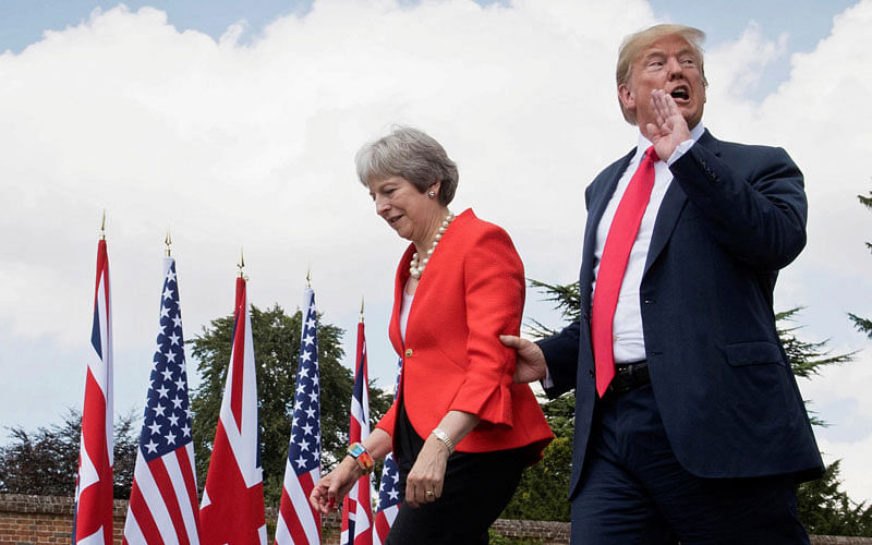 US president Donald Trump walks with Britain`s prime minister Theresa May prior to a joint press conference at Chequers, near Aylesbury, Britain on 13 July 2018. Photo: Reuters