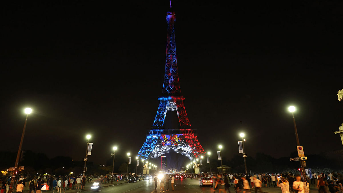 The Eiffel Tower is illuminated Blue, White and Red, colors of the french flag, as a tribute to the french football team who won the world cup for the second time in history on 15 July, 2018, in Paris.  Photo: AFP