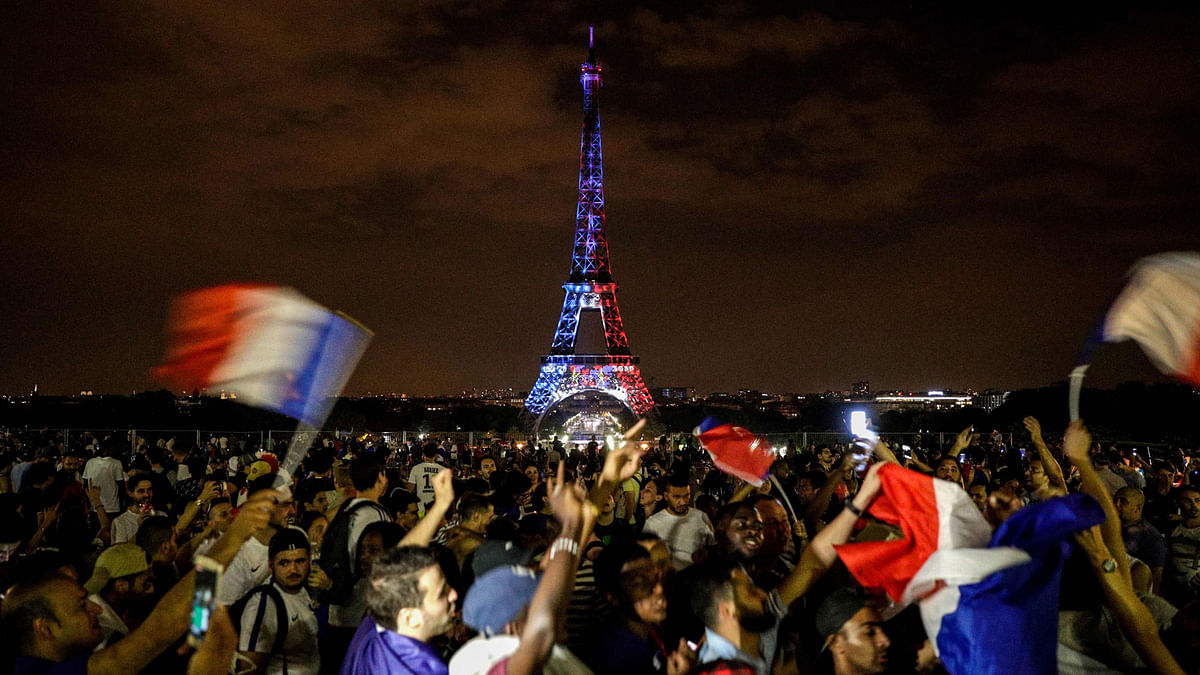 People celebrate France`s victory in the Russia 2018 World Cup final football match between France and Croatia in Paris.  Photo: AFP