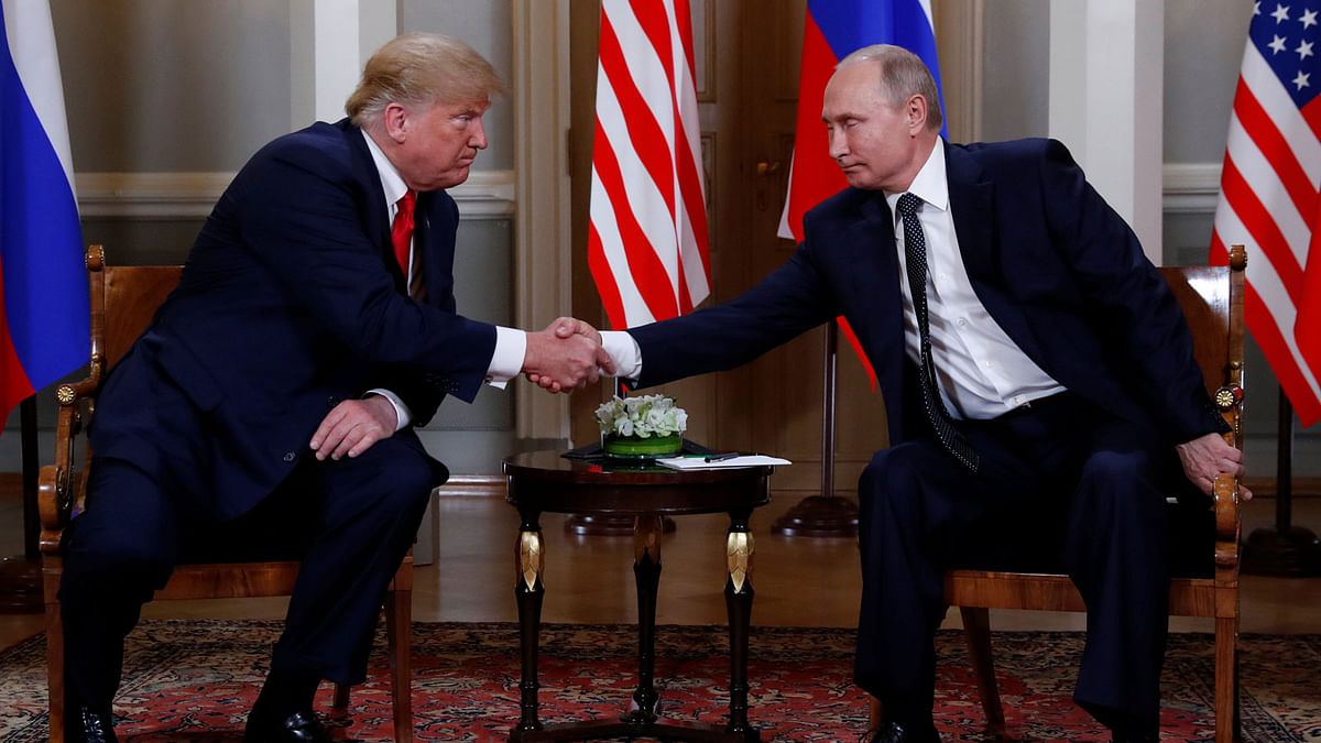 US president Donald Trump and Russia`s president Vladimir Putin shake hands as they meet in Helsinki, Finland 16 July 2018. Photo: Reuters