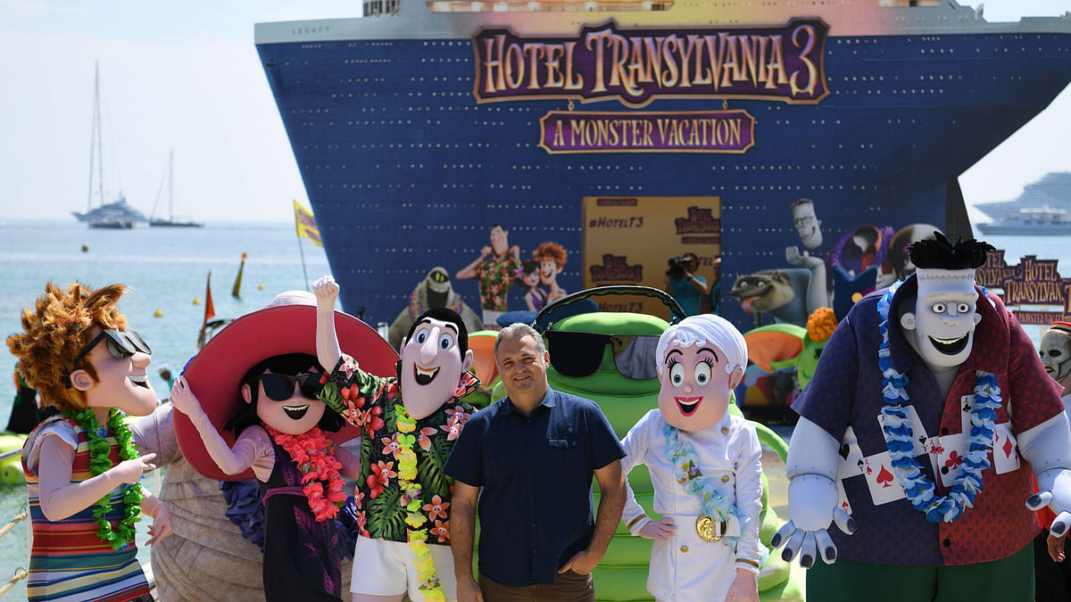 In this file photo taken on 7 May, 2018 Russian-US director Genndy Tartakovsky (C) poses during a photocall for the animated film `Hotel Transylvania 3 : A Monster Vacation` on the eve of the opening of the 71st edition of the Cannes Film Festival in Cannes, southern France. Photo: AFP