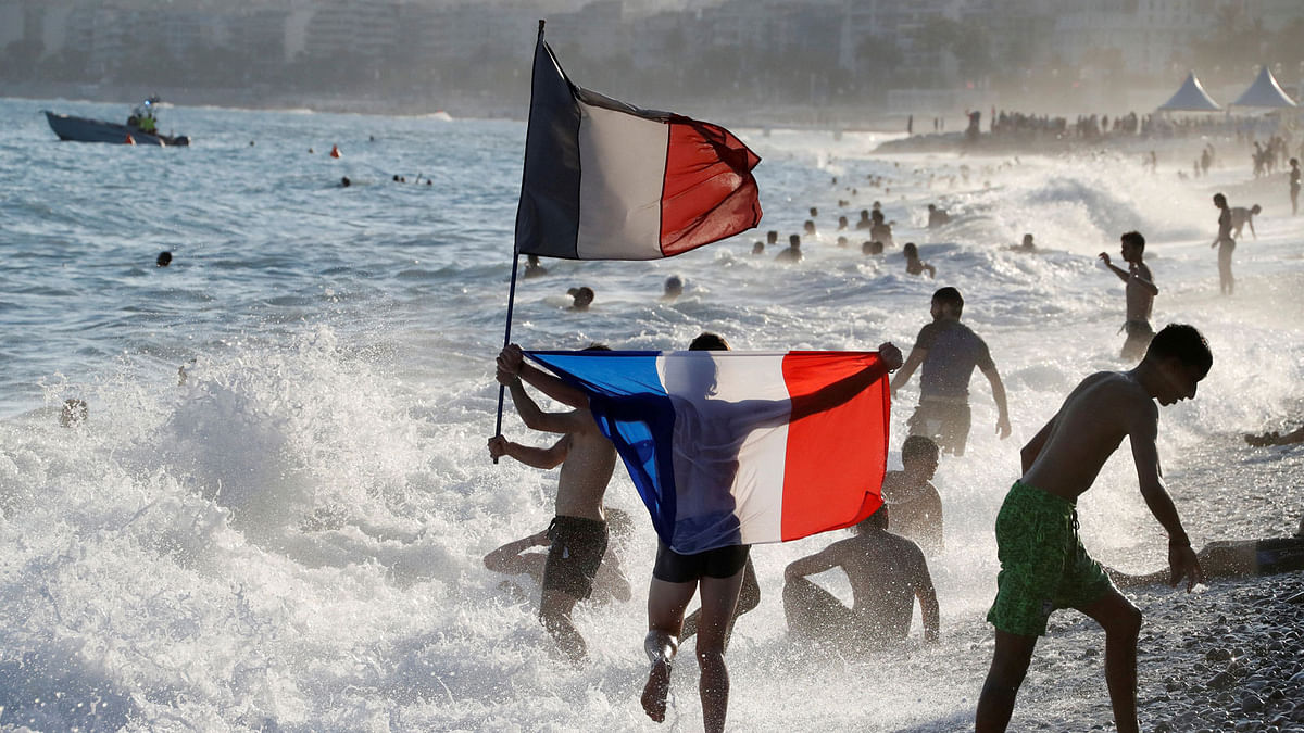 France fans celebrate on the beach in Nice, France after they defeated Croatia in their Soccer World Cup final match. Photo: Reuters