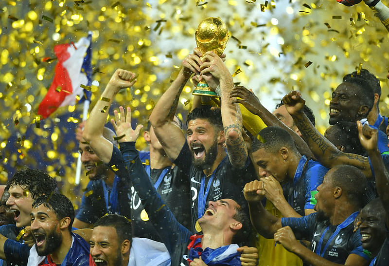 France`s Olivier Giroud lifts the trophy as they celebrate winning the World Cup REUTERS 2