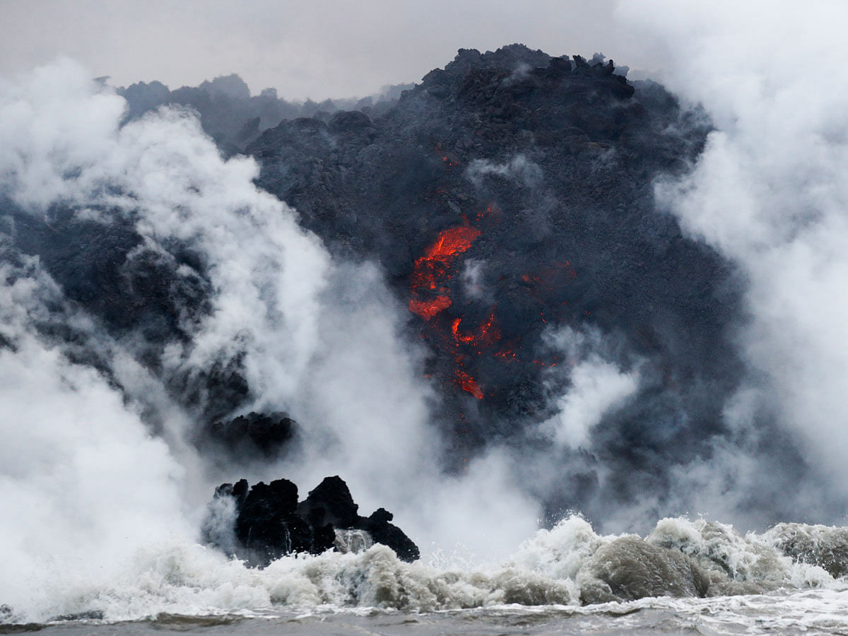 In this 20 May, 2018 file photo, lava flows into the ocean near Pahoa, Hawaii