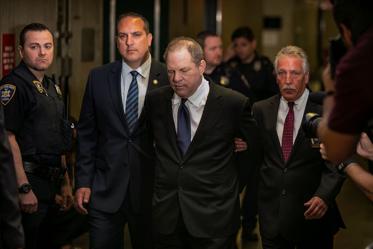 Film producer Harvey Weinstein is led handcuffed by police into his hearing at Manhattan Criminal Court in New York City, US on 9 July. Photo: Reuters