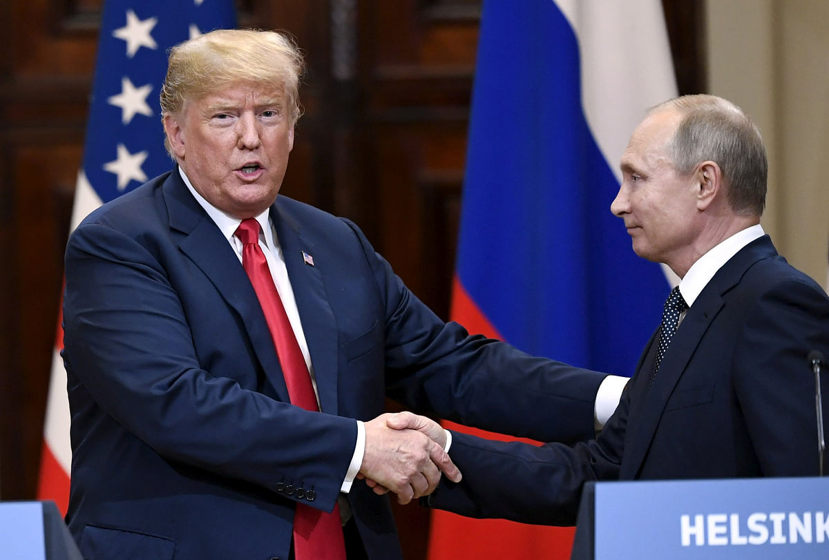 US president Donald Trump and Russia`s president Vladimir Putin shake hands after their joint news conference in the Presidential Palace in Helsinki, Finland on 16 July, 2018. Photo: Reuters