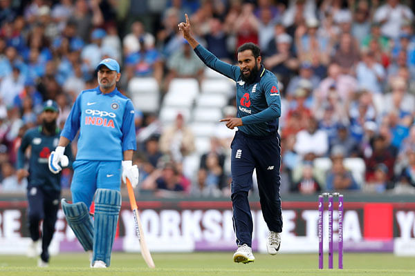 England`s Adil Rashid celebrates taking the wicket of India`s Suresh Raina in the Third One Day International at Emerald Headingley, Headingley, Britain on 17 July 2018. Photo: Reuters
