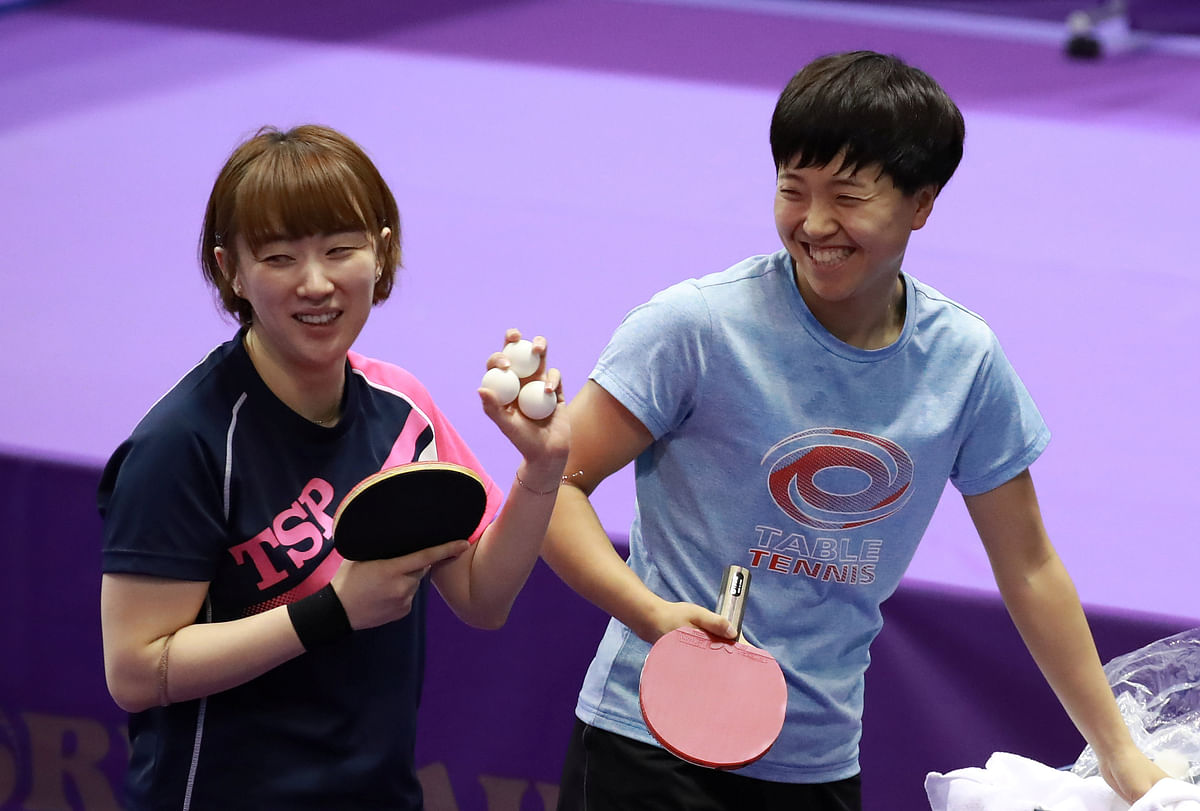 North Korea`s table tennis player Kim Song-yi and South Korea`s table tennis player Seo Hyo-yeon who teamed up for women`s double, take part in a joint training session ahead of the Seamaster 2018 ITTF World Tour Platinum Korean Open in Daejeon. Photo: Reuters