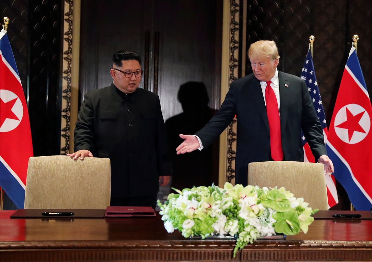 US president Donald Trump and North Korea’s leader Kim Jong Un arrive to sign a document to acknowledge the progress of the talks and pledge to keep momentum going, after their summit at the Capella Hotel on Sentosa island in Singapore on 12 June. Photo: Reuters