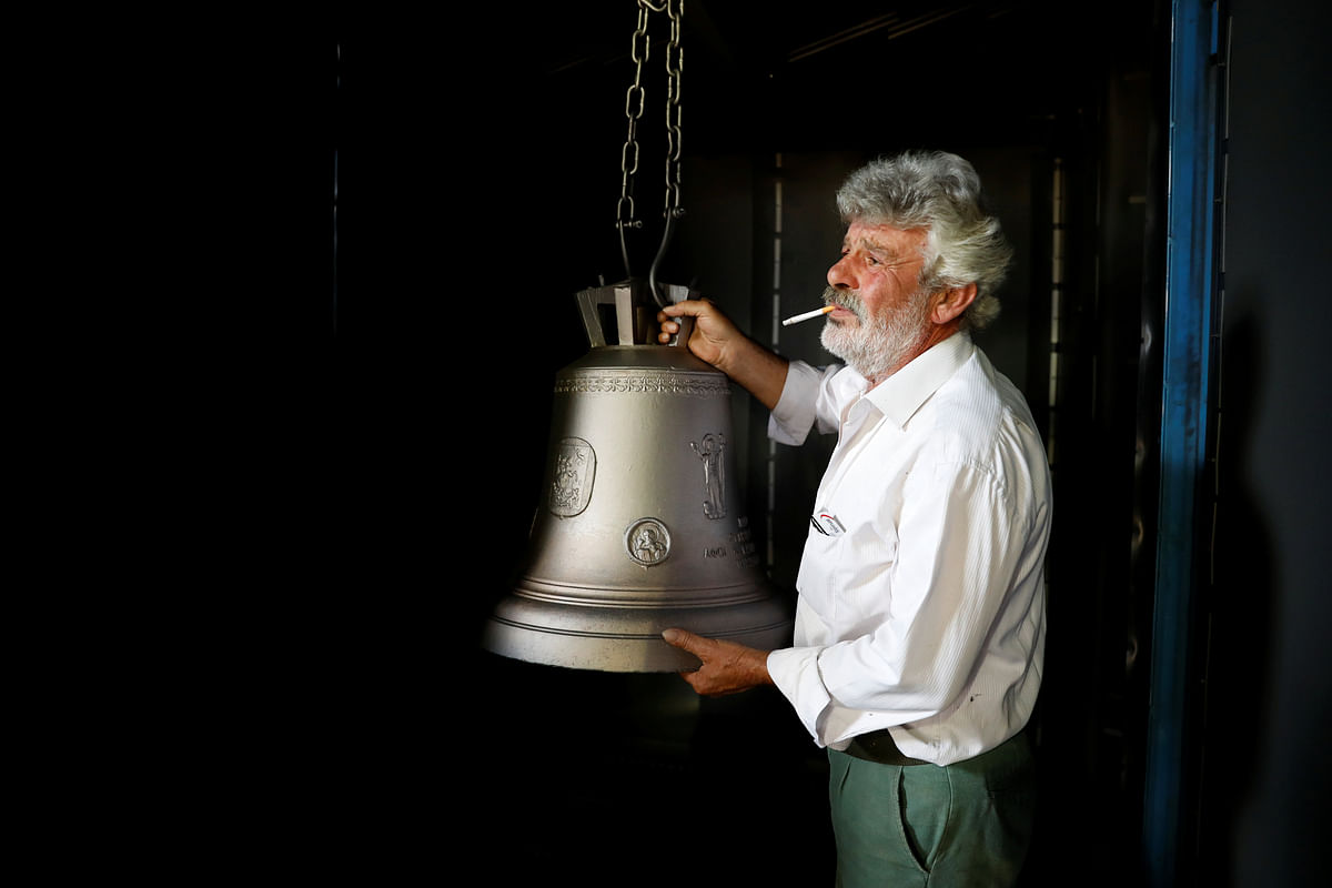 Thomas Galanopoulos, 59, holds a cleaned bell at his family`s bell foundry in Paramythia, Greece on 10 July 2018. `You have to be nuts about this job to do it. It`s not for everyone,` Thomas said. Photo: Reuters