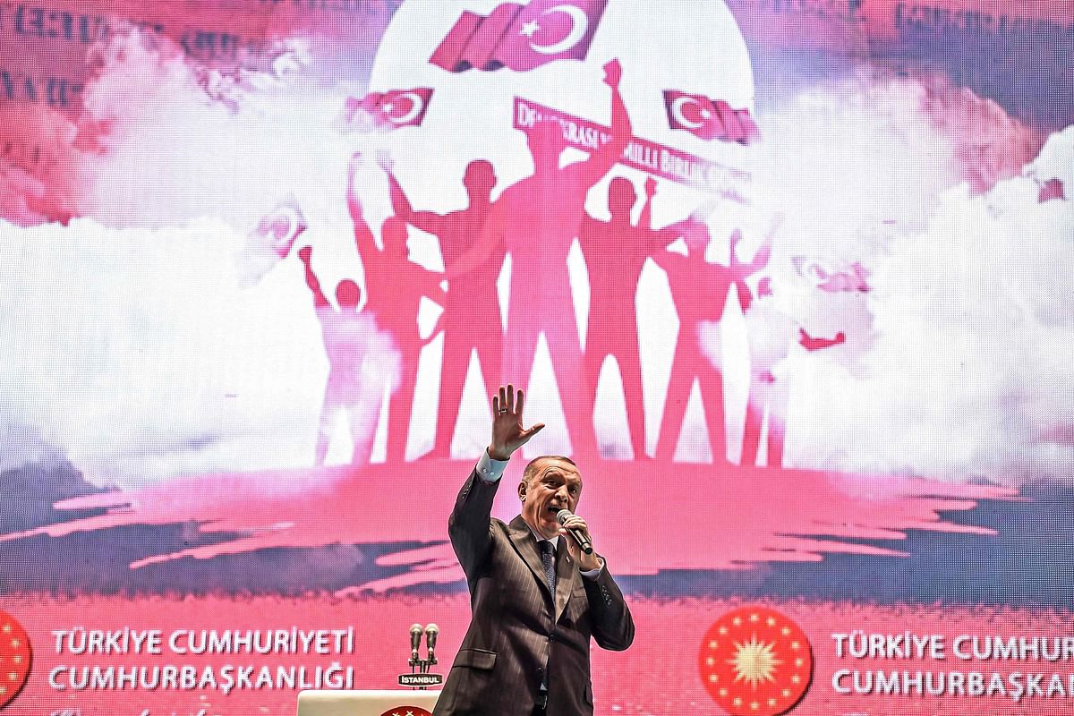 Turkey`s President Recep Tayyip Erdogan delivers a speech at a ceremony site on `July 15 Martyrs Bridge` (Bosphorus Bridge) in Istanbul on 15 July 2018. Photo: AFP