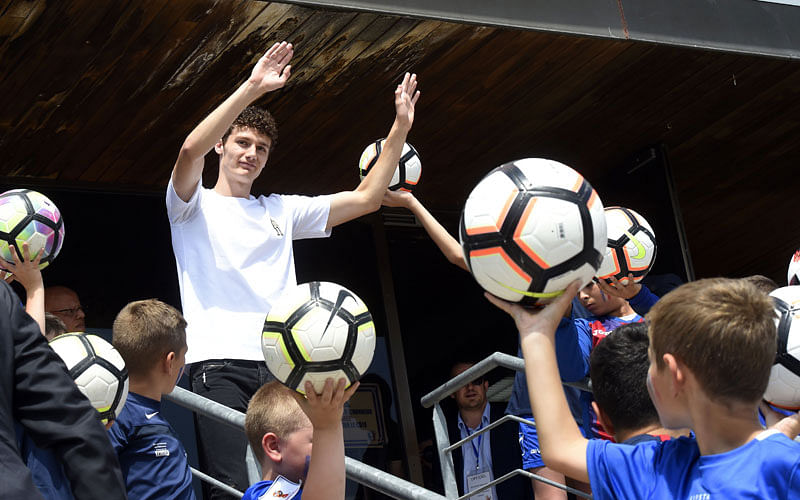 In this file photo taken on 18 July 2018 Benjamin Pavard waves to the crowd in his home town of Jeumont, northern France, three days after French players won the Russia 2018 World Cup final football match. French Stuttgart defender Benjamin Pavard signed a contract to join Bayern Munich in 2019 during the World Cup, but the Bavarian club would like to attract the brand new world champion this summer, says German regional public broadcaster SWR on 19 July 2018. -- AFP