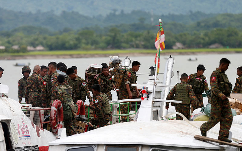 Myanmar soldiers arrive at Buthidaung jetty on August 2017. File Photo: Reuters