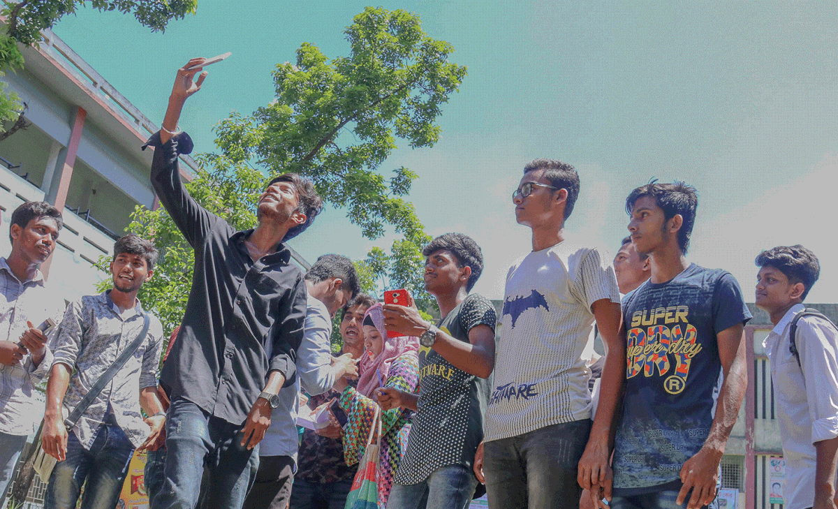 Celebration without selfie? No way! Students of Khulna MM City College take selfies to celebrate their success. Photo: Saddam Hossain