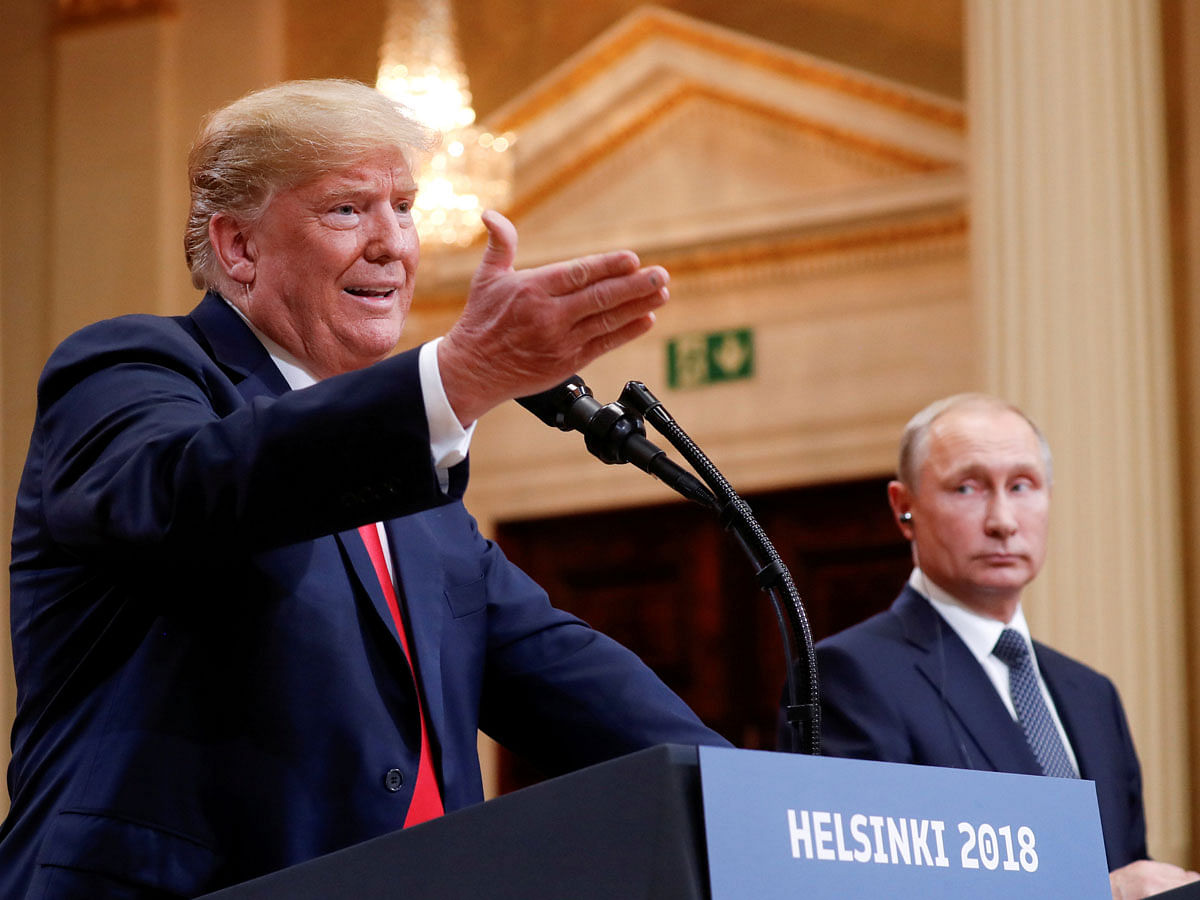 US president Donald Trump gestures during a joint news conference with Russia’s President Vladimir Putin after their meeting in Helsinki, Finland on 16 July. Photo: Reuters
