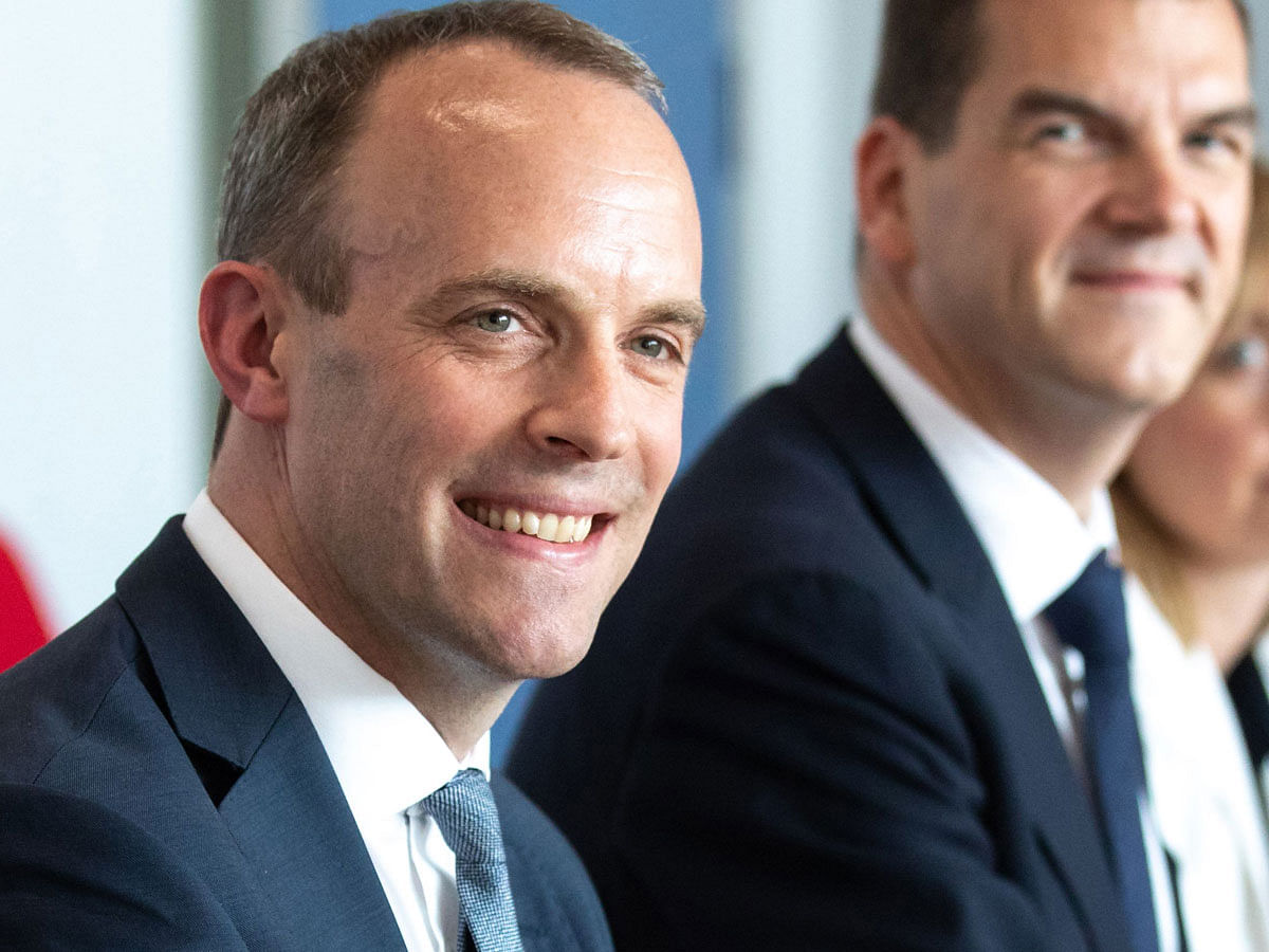 Britain’s secretary of state for Exiting the European Union (Brexit Minister) Dominic Raab (L) attends a meeting with EU’s chief Brexit negotiator at the European Commission in Brussels on 19 July. Photo: AFP