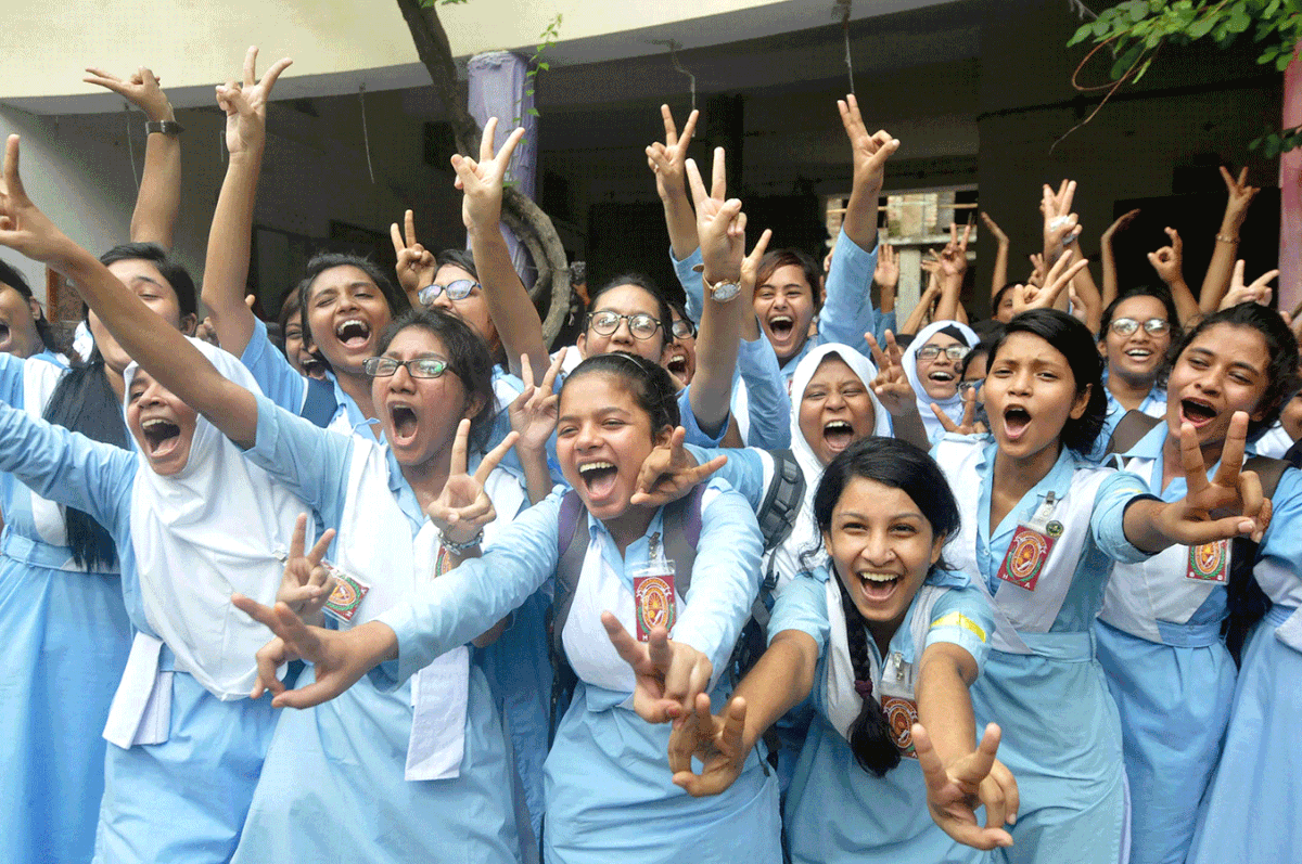 The joy beyond time and limit. Students of Viqarunnisa Noon College, Dhaka show victory signs after results. Photo: Hassan Raja