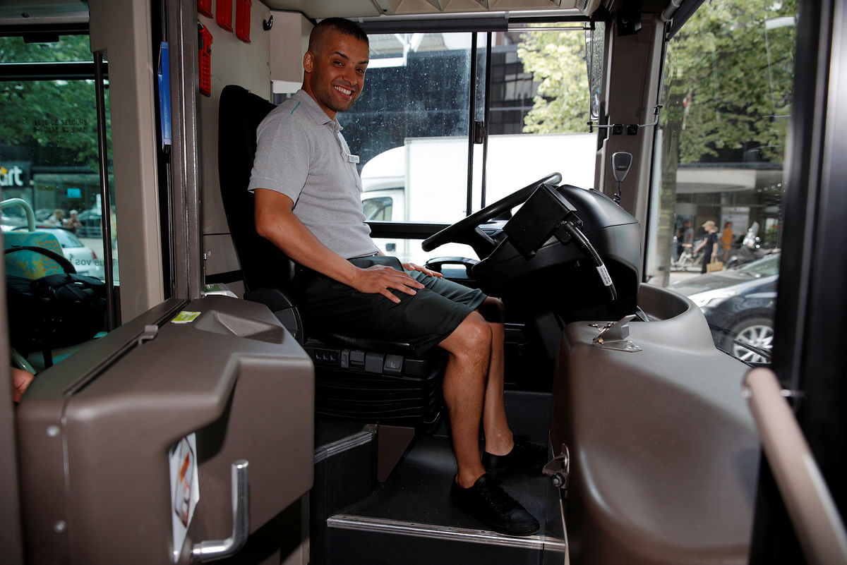 Paris bus driver Abdelkader poses in a bus wearing a bermuda, the new RATP uniform allowed during heat waves in the French capital, in Paris, France, on 4 July 2018. Photo: Reuters