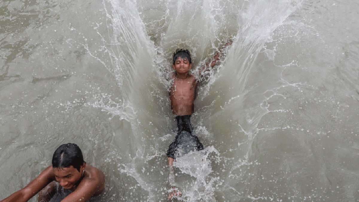 Children swim in Buriganga river in Farashganj Ghat on 20 July. The picture has been taken from Farashganj Ghat on 20 July by Dipu Malakar.