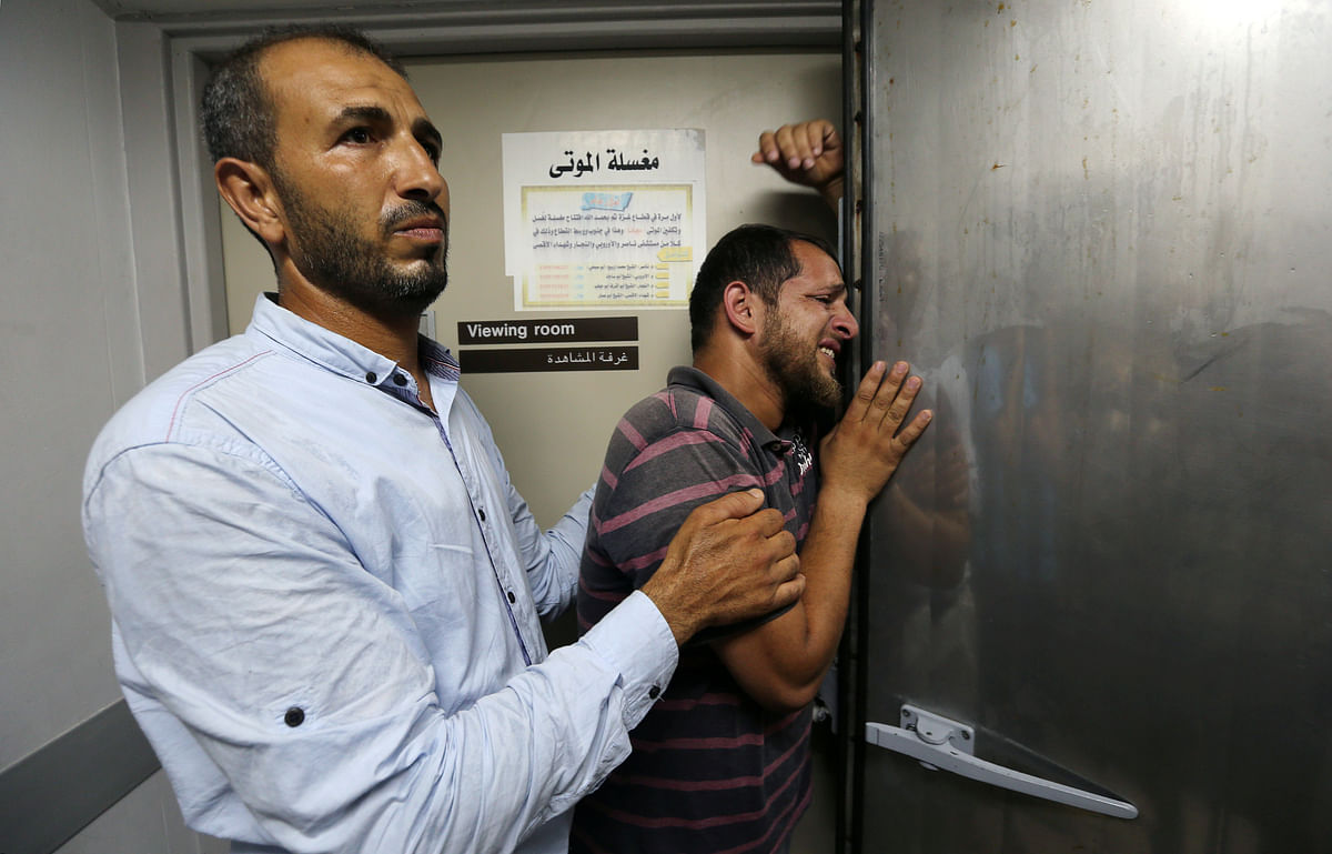A relative of a Palestinian who was killed by Israeli troops east of Khan Younis, reacts at hospital in the central Gaza Strip on 20 July 2018. Photo: Reuters