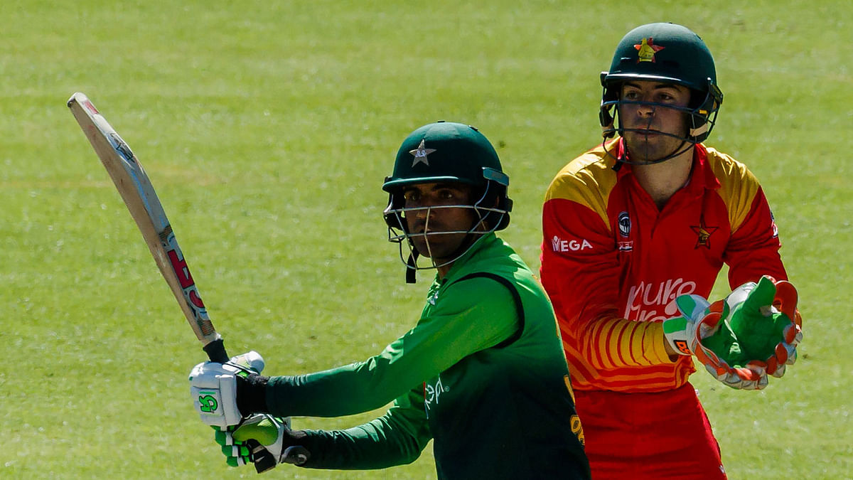 Pakistan`s batsman Fakhar Zaman (L) prepares to play a shot next to Zimbabwe`s wicket keeper Ryan Murray during the final cricket match of a five-match ODI series played between Pakistan and host Zimbabwe at Queens Sports Club in Bulawayo, on 22 July 2018. AFP