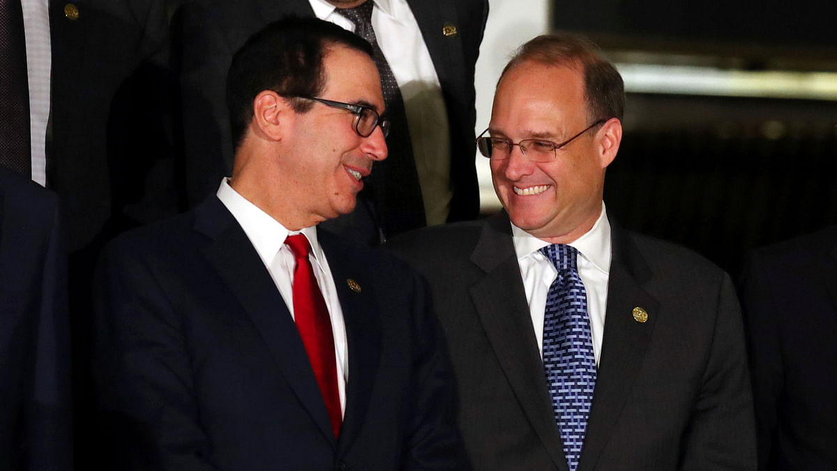 US secretary of the treasury Steven Mnuchin talks to Financial Action Task Force president Marshall Billingslea as they pose for the official photo at the G20 Meeting of Finance Ministers in Buenos Aires, Argentina on 21 July. Photo: Reuters