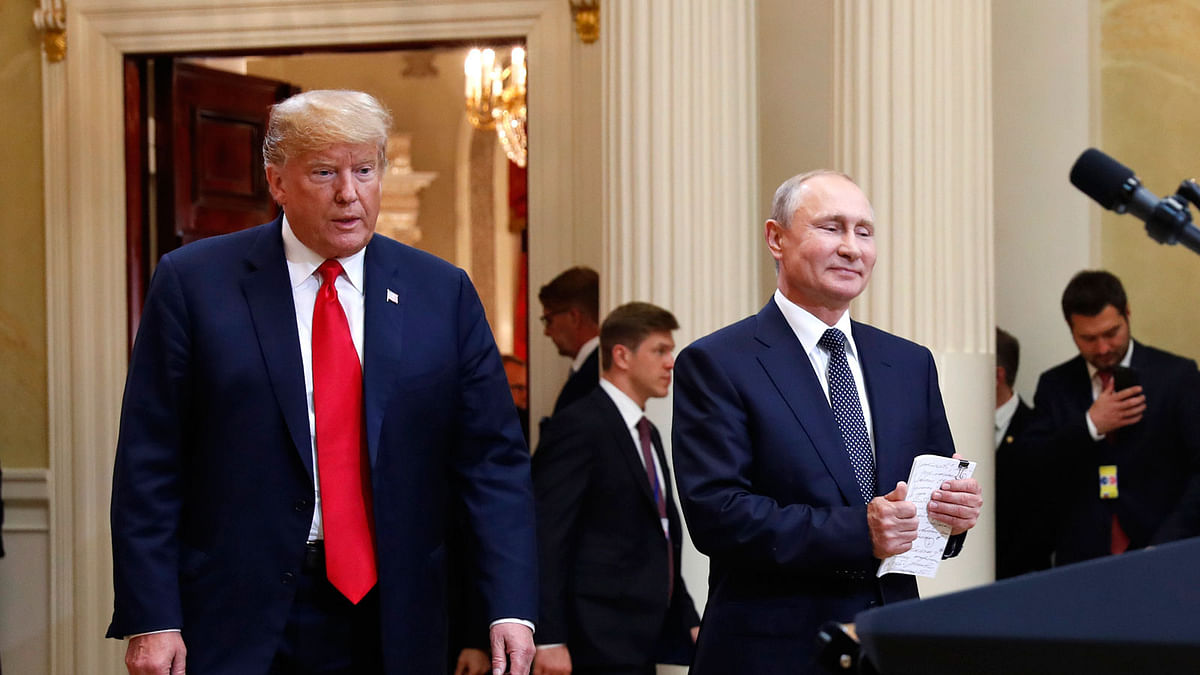 In this 16 July 20198, photo, US president Donald Trump, left, and Russian president Vladimir Putin arrive for a news conference at the Presidential Palace in Helsinki, Finland. Photo: AP